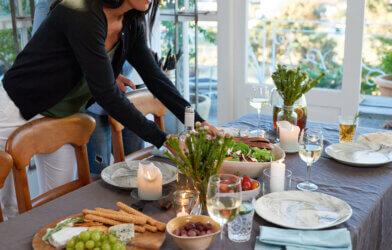 Woman setting the table for party