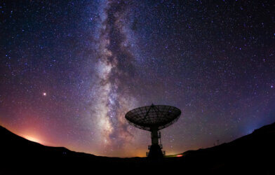 Illustration of a radio telescope satellite pointed at the stars in space.