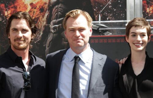 Christian Bale, Christopher Nolan, and Anne Hathaway in 2012