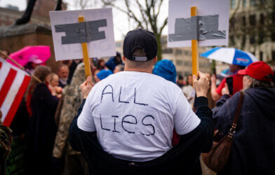 conspiracy theorist at protest