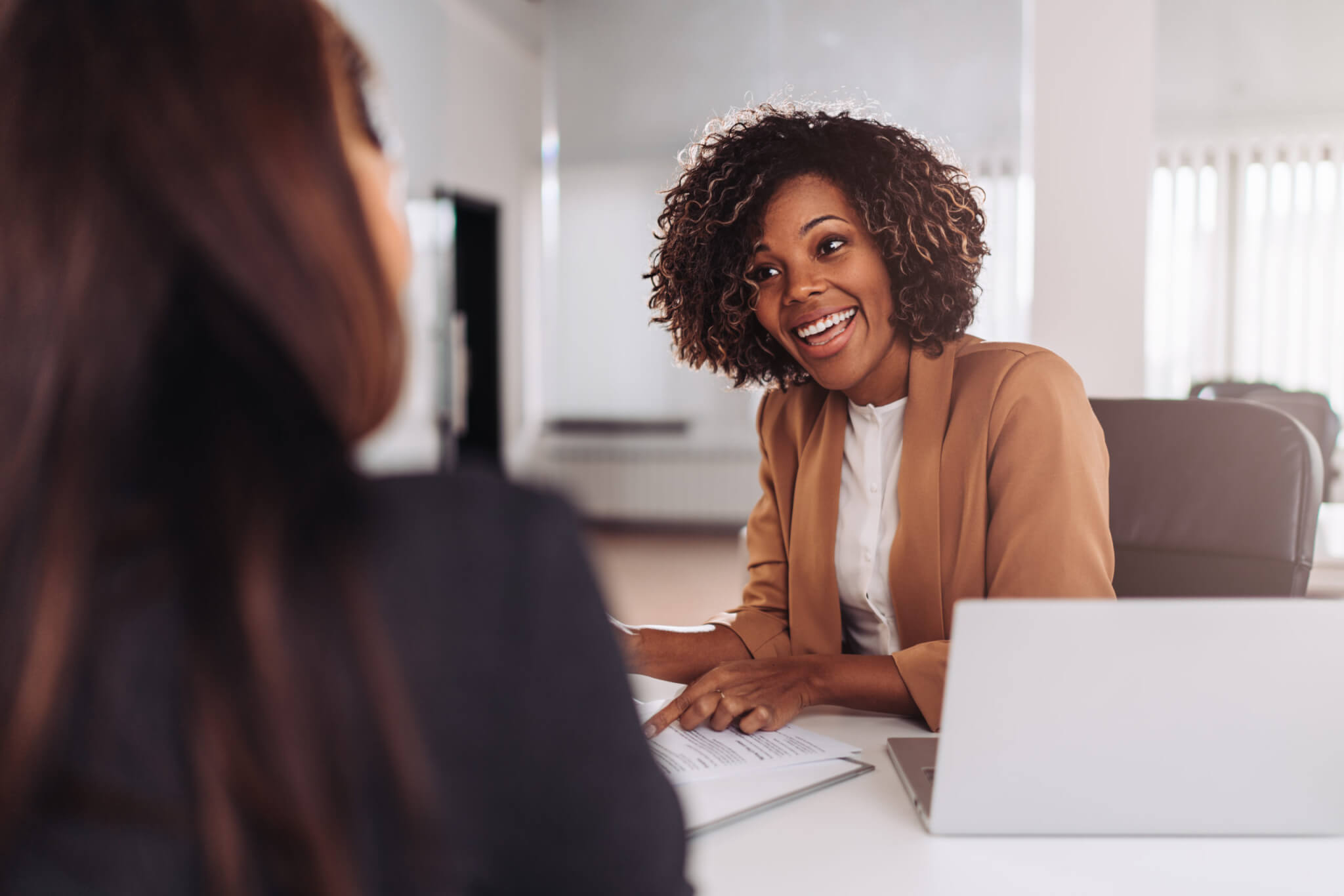 Manager talking to colleague or interviewing a job candidate